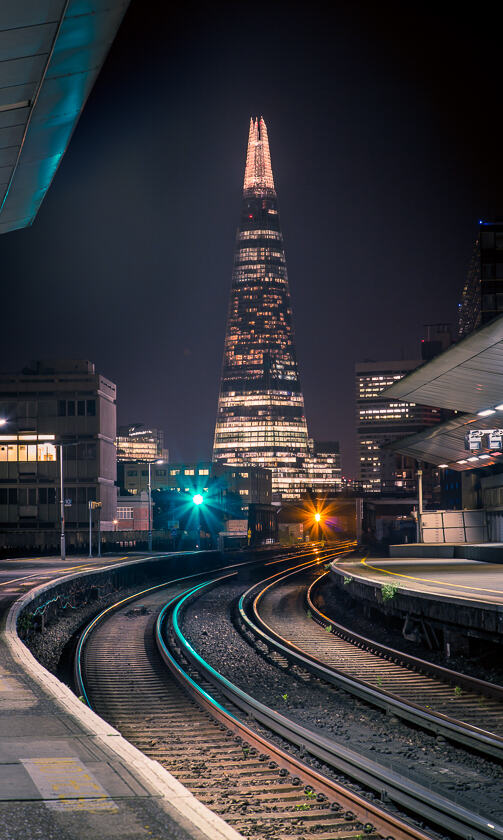 A view of the Shard from London Waterloo East Railway Station at night.