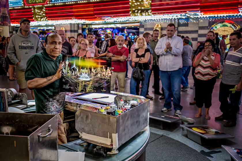 Spray artist Tony Vegas displays a finished painting in the Fremont Street Experience, Las Vegas.
