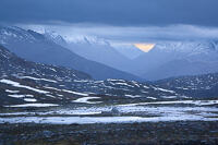 Snow-capped mountains near Tromsø, Northern Sweden a couple of weeks from the start of the Polar Night.